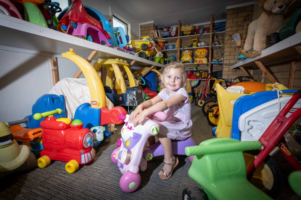 Sophie Bowman looks for that special toy in the treasure trove of toys kept in the Tamworth Toy Library, which celebrates 40 years of operation on Saturday, October 28. Picture by Peter Hardin