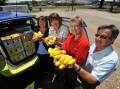 Lisa Cross, Tracey Watt, Karen Cox, and David Lodge receive a banana donation.  Picture by Barry Smith