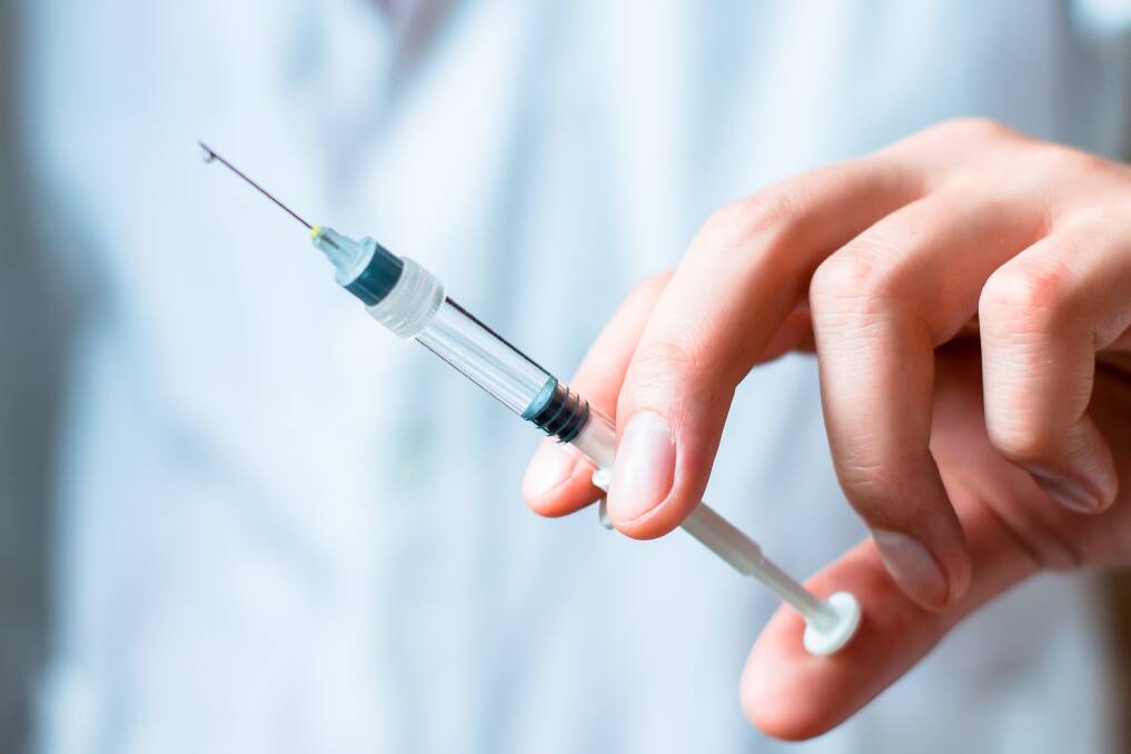 People are getting vaccinated against the flu. Shutterstock