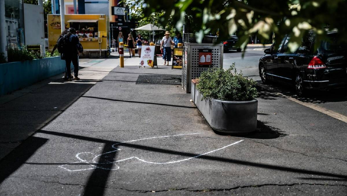 The cans of beetroot were gone by Tuesday but an akubra had been added to the chalk drawing. Picture by Karleen Minney 