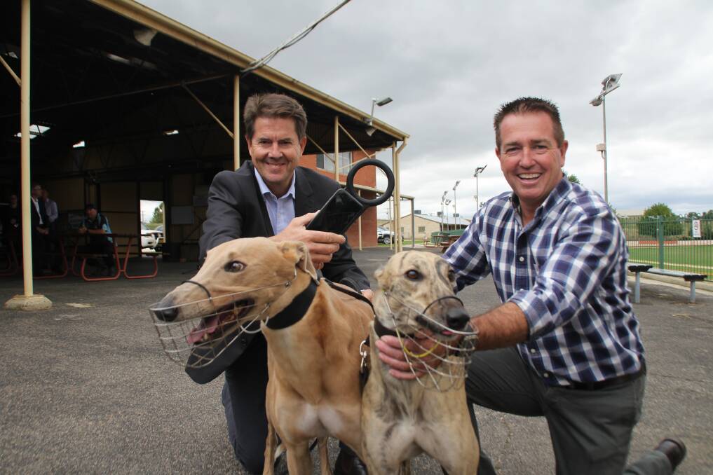 NEW TECH: Minister for Better Regulation and Innovation Kevin Anderson and Bathurst MP Paul Toole, with Left Turn Clyde and Landon's Mate. Photo: BRADLEY JURD