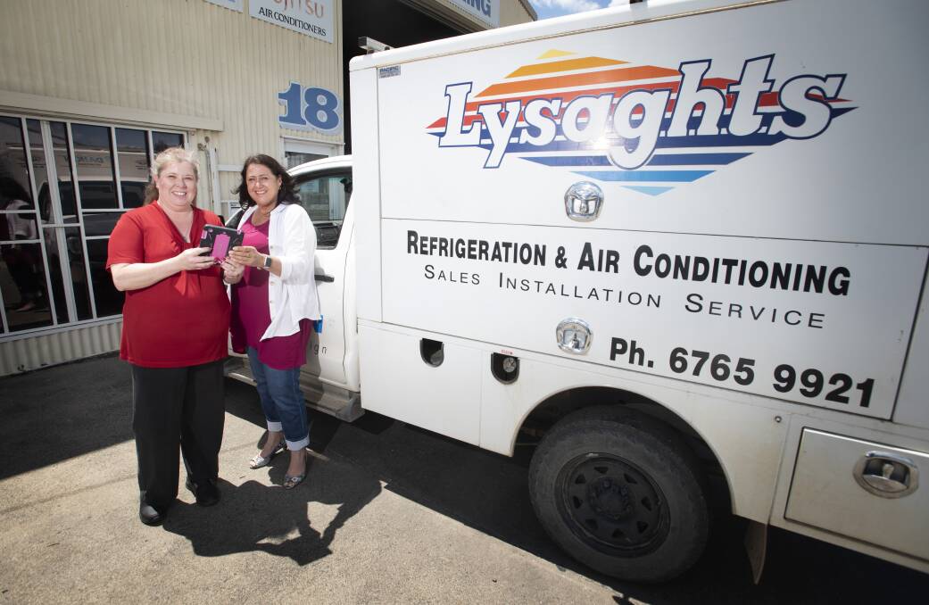 On the hop: Cecelia Green and Jo Lysaght from Lysaghts Refridgeration & Air Conditioning know the meaning of the word 'busy'. Photo: Peter Hardin.