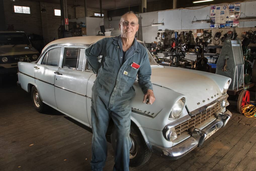 A FINE VINTAGE: Manilla Vintage Machinery Club president Tim Scanlon with one of the old Australian Holden's from his collection. The Manilla Machinery Rally is on this weekend, with hobbyists travelling from all over the country. Photo: Peter Hardin 