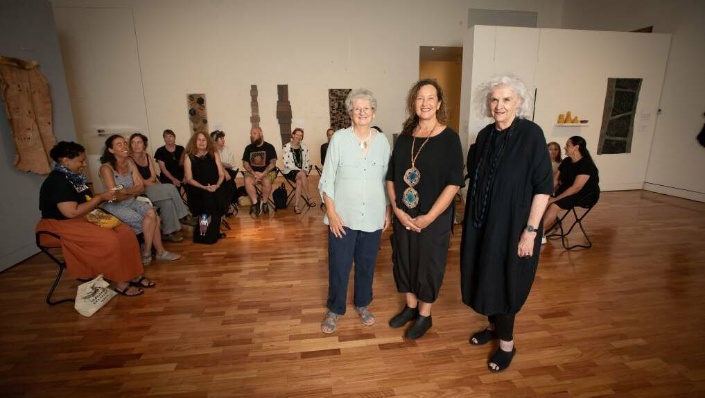 Artist Sybil Orr, Curator Dr Carol McGregor, and artist Liz Williamson in front of textile artists from nearly every state in Australia and every corner of the world. Picture by Peter Hardin, from file.
