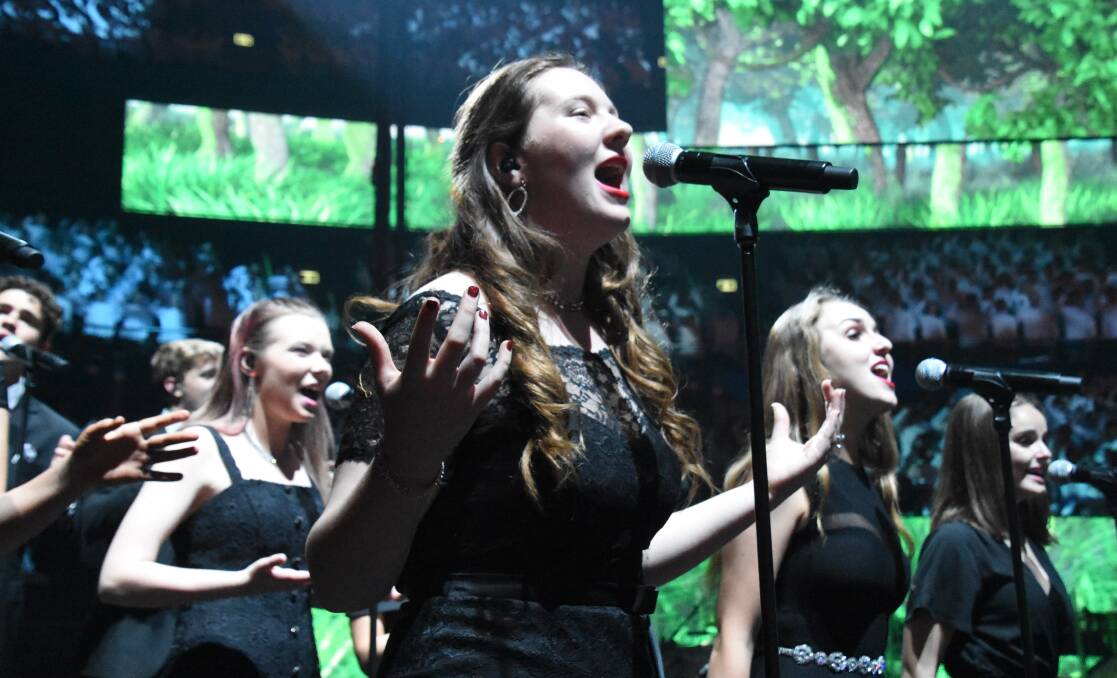 Uplifting: Hannah Burton of Oxley High was a driving force behind the music of the Schools Spectacular as one of the elite backing vocalists. Photo: Supplied.