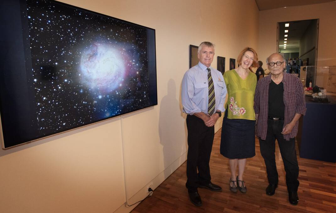 Out of this world: Cr Phil Betts, Gallery director Bridget Guthrie and artist Hugh Oliveiro. Photo: Peter Hardin 061219PHC006