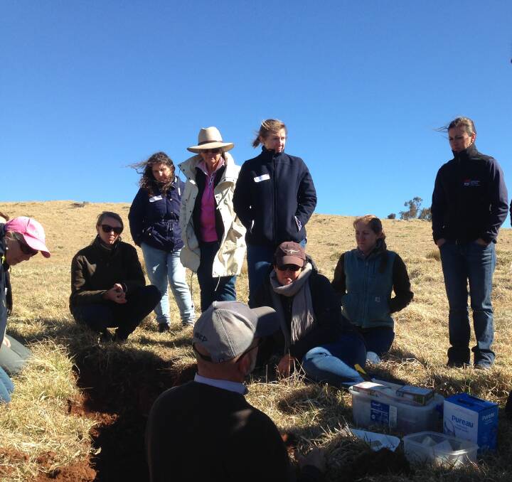 Guyra Ladies in Livestock group listen to soils expert David Hardwick in the soil pit at the Guyra Soil Health & Production Workshop. Photo: Supplied.
