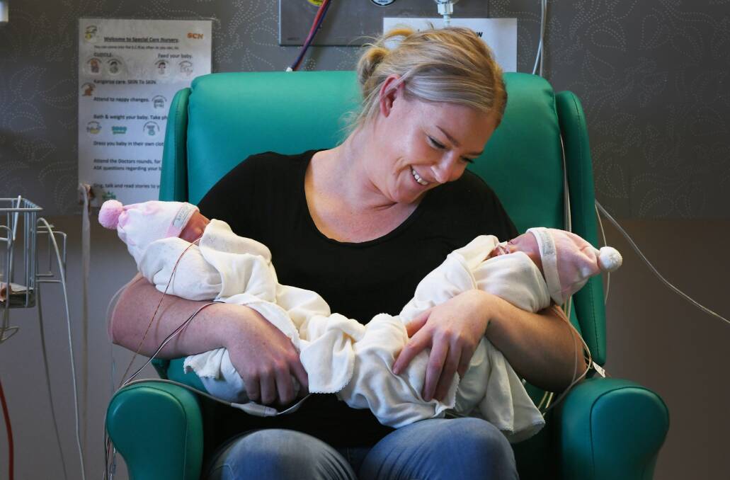 COMPLETE CARE: Paige Oliver (Mum) with baby twins Paityn and Paicey, who have been staying in the special care nursery. Photo: Gareth Gardner 150620GGB09