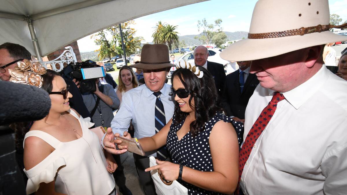 On the hop: Malcolm Turnbull and Barnaby Joyce meet punters at the Tamworth racetrack in 2017.  
