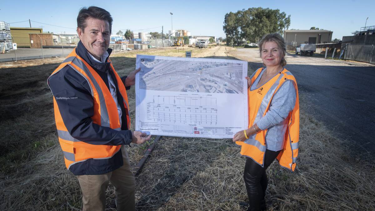 GROUND BREAKING: MP Kevin Anderson and Transport for NSW Regional Director Anna Zycki show off plans for the Tamworth intermodal hub. Photo: Peter Hardin 050520PHA006