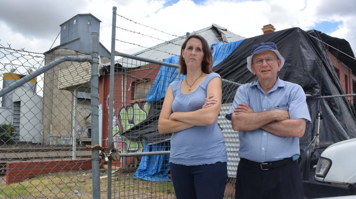 GOING SOON: Historical society members Melinda Gill and Rod Hobbs don't want the West Tamworth station torn down. Photo: Jacob McArthur