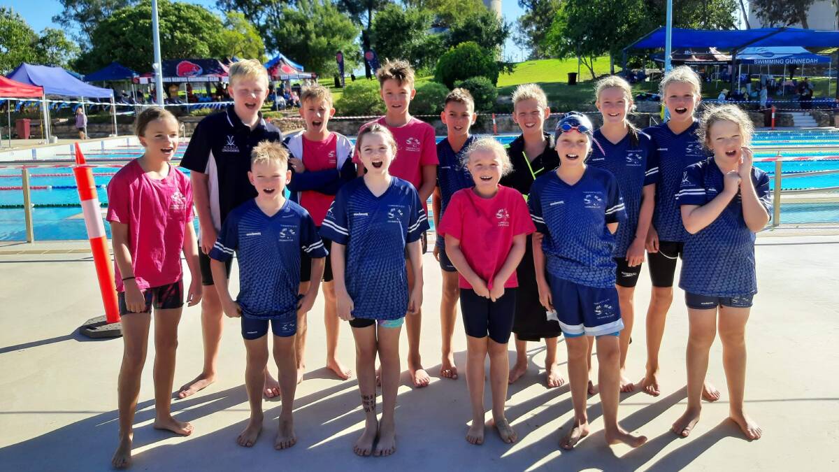 Winners are grinners: Tamworth City Swimming Club members celebrate their great win. Photo: Supplied.