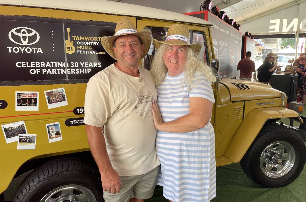 Fabio and Dianne Paoletti were the first festivalgoers to snag themselves a Toyota straw hat. Picture by Tess Kelly