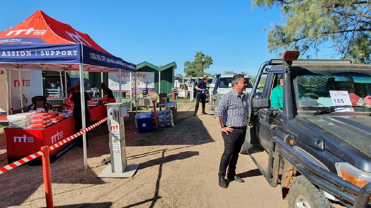 On the ground: Deputy Premier John Barilaro meets with a farmer via the drive through BBQ at the Walgett event on Friday. Photo: Supplied.