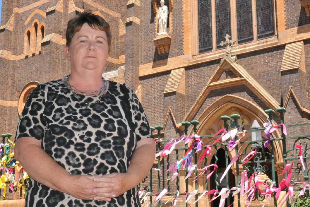 Bishop's backflip: Sexual abuse survivor and Loud Fence advocate Robyn Knight is pleased with Catholic Diocese of Armidale’s Bishop Michael Kennedy's decision to leave ribbons on the Armidale Catholic Cathedral fence.