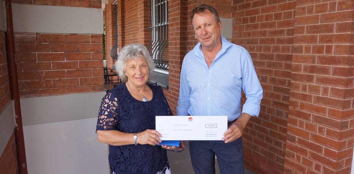 Economic boost: Narrabri Shire Council Mayor Cathy Redding receives a cheque for $25,000 from Member for Barwon Kevin Humphries.