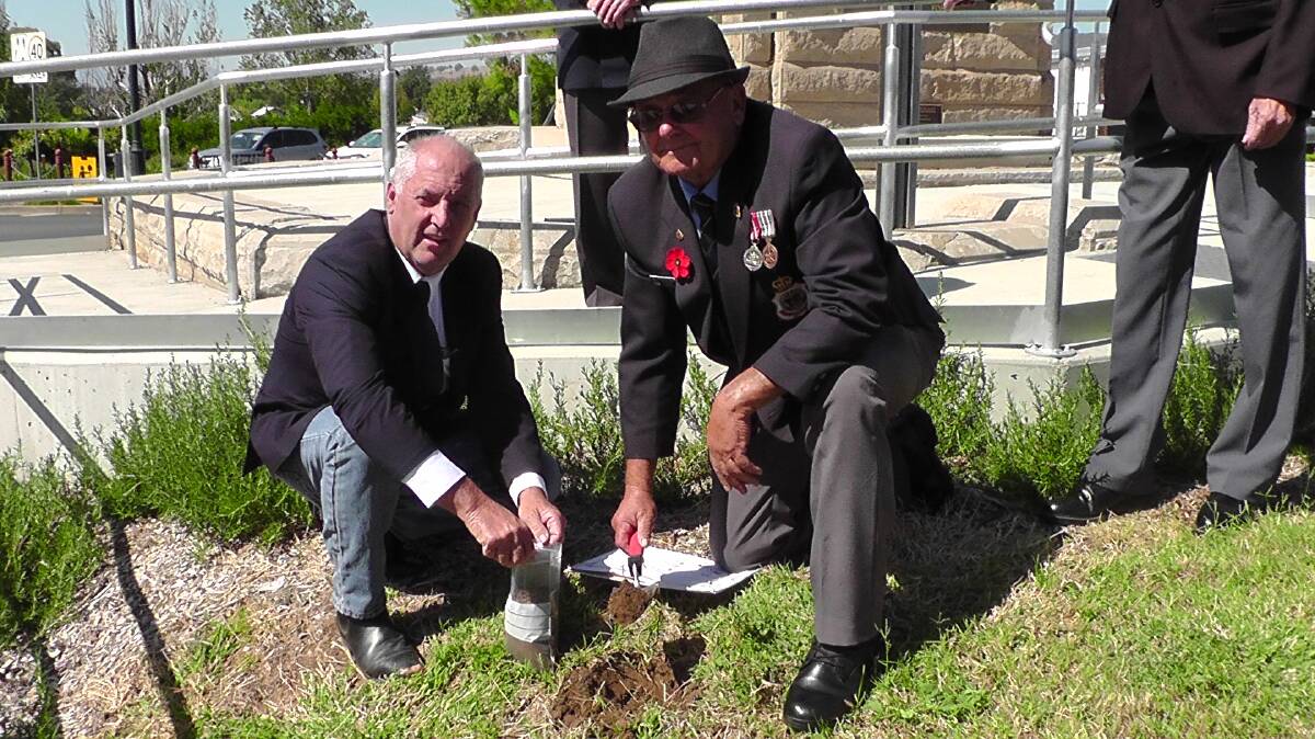 LPSC Mayor, Councillor Andrew Hope and Deputy Mayor and President of the Quirindi RSL Sub-Branch, Councillor Doug Hawkins gather the soil sample to be sent to Sydney.