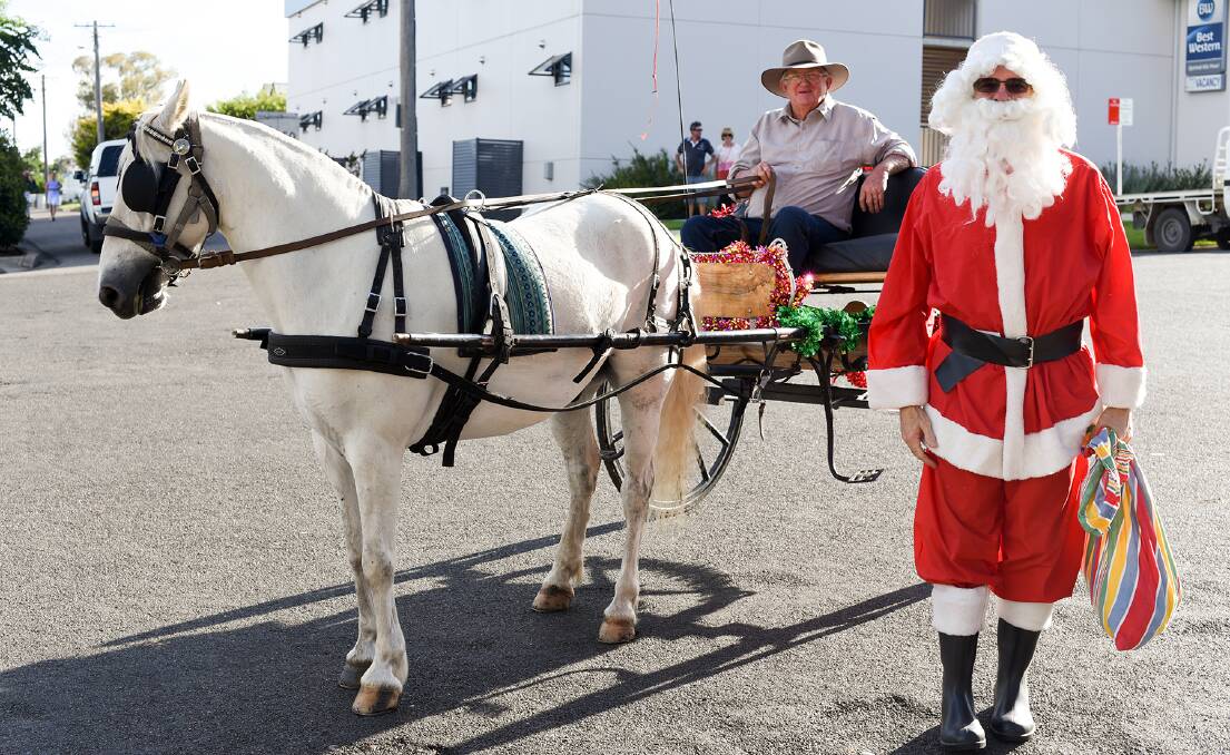 Santa arrived via horse and carriage.