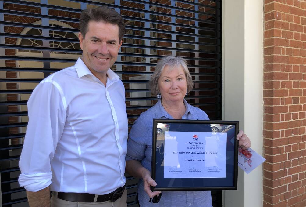Well done: Kevin Anderson presents LouEllen Overton with her award. Photo: Supplied.