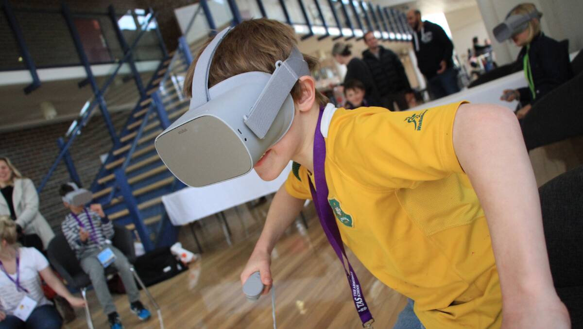 Sam Hynes tries out the Virtual Reality goggles at last years STEM Open Day