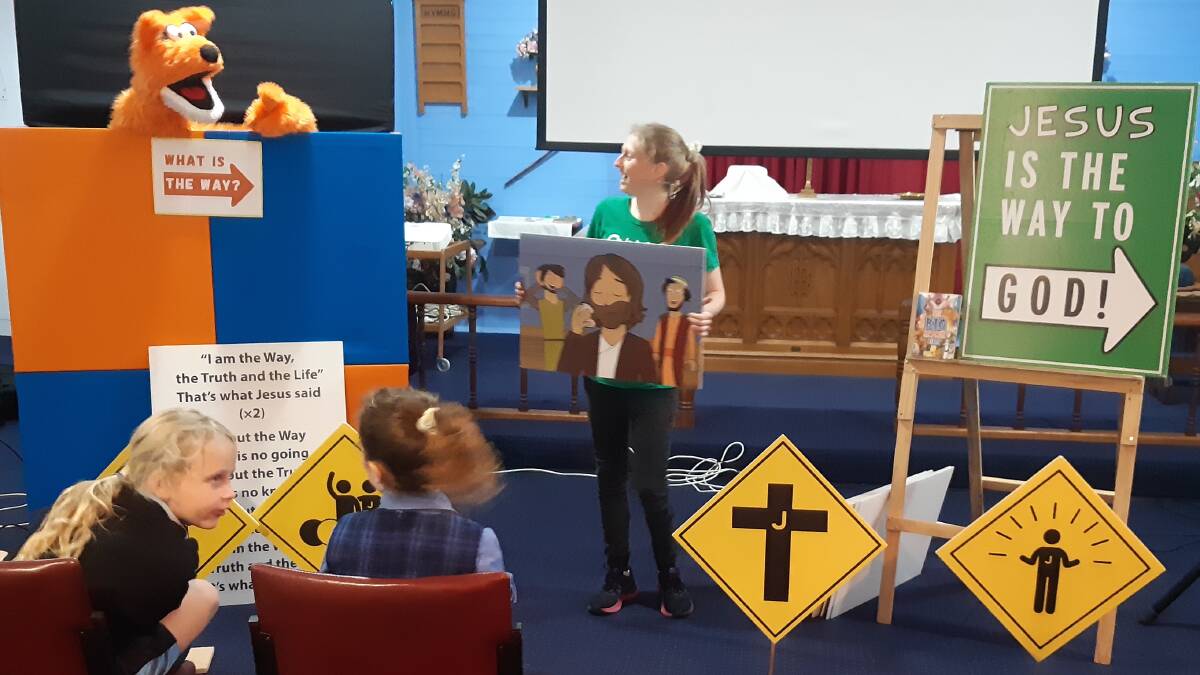 Lots of fun: Quiz Word visited the weekly Kootingal Kids Club. Larissa warns Sherbie not to miss the signs along the way. Photo: Supplied