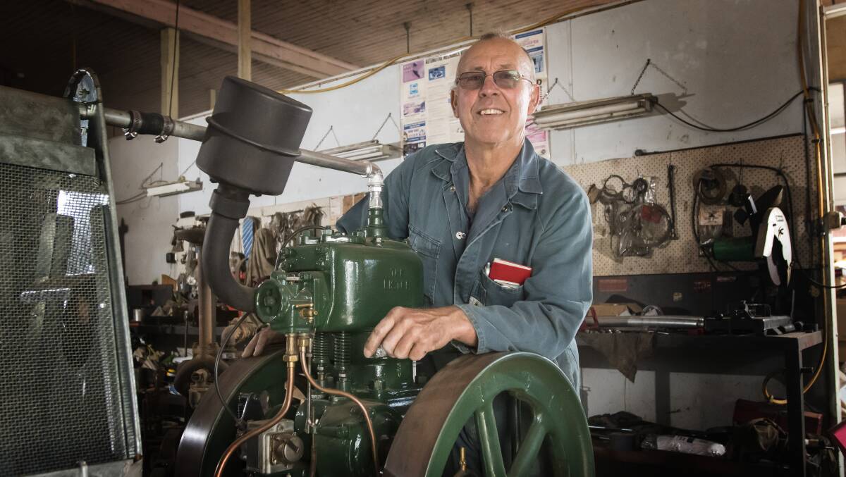 RESTORATION RUMBLE: Manilla Vintage Machinery Club president Tim Scanlon with a stationary engine. Photo: Peter Hardin
