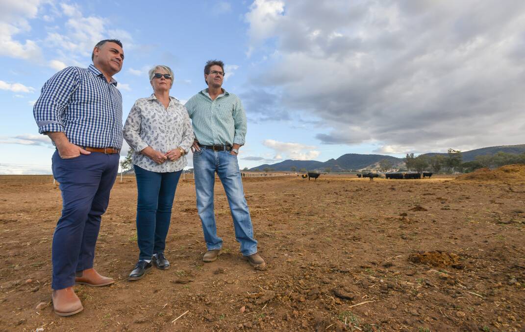 DUST BOWL: John Barilaro and Kevin Anderson inspect the dry conditions with local farmer Liz Coxhead. Photo: Jamieson Murphy