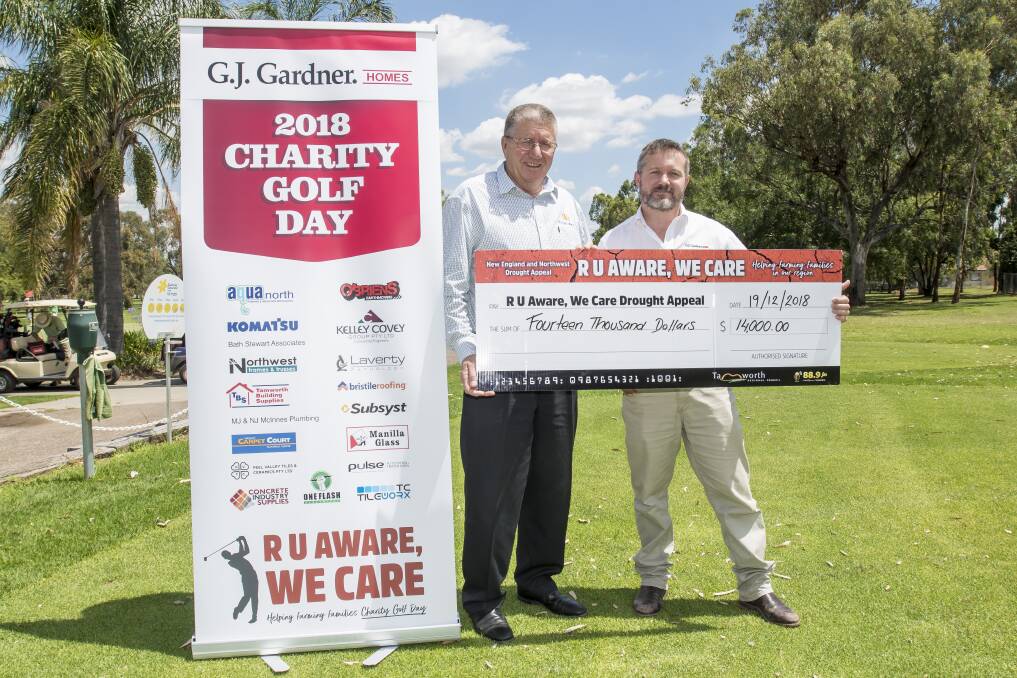 BIG DONATION: Tamworth mayor Col Murray and Tamworth GJ Gardner owner Daniel Urquhart with a big cheque for a big donation. Photo: Peter Hardin