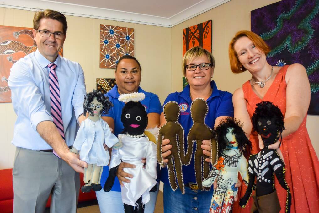 SYMBOLIC MEANING: Kevin Anderson, Loretta Weatherall, Lyniece Keogh and Tamworth art galley director Bridget Guthrie with some of the dolls. Photo: Jamieson Murphy 251116JM001