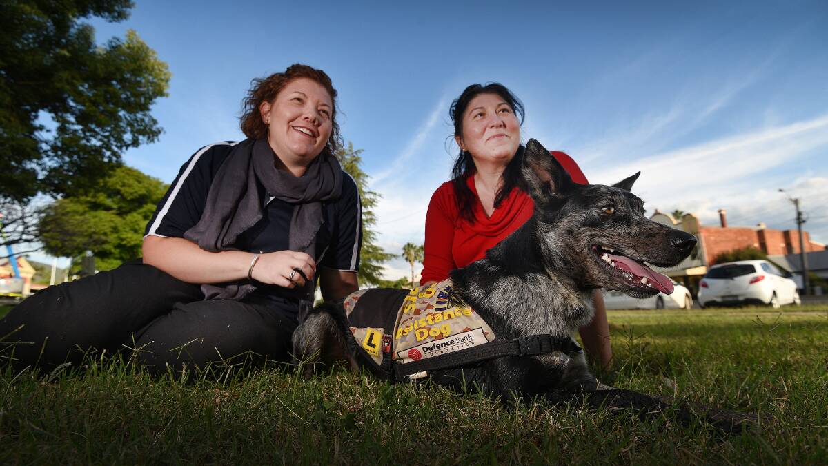 BY THE LEFT: Libby Ryman, Rebecca Linich and her support dog Tucky will be marching up the front this Anzac Day. Photo: Gareth Gardner