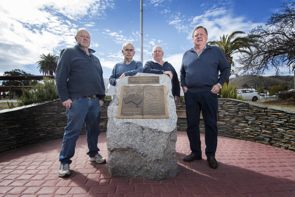 MOMENT TO REFLECT: Geoffrey Cox, John Drysdale, Ray Stevens and Wally Franklin at the Tamworth Vietnam War Memorial. Photo: Peter Hardin