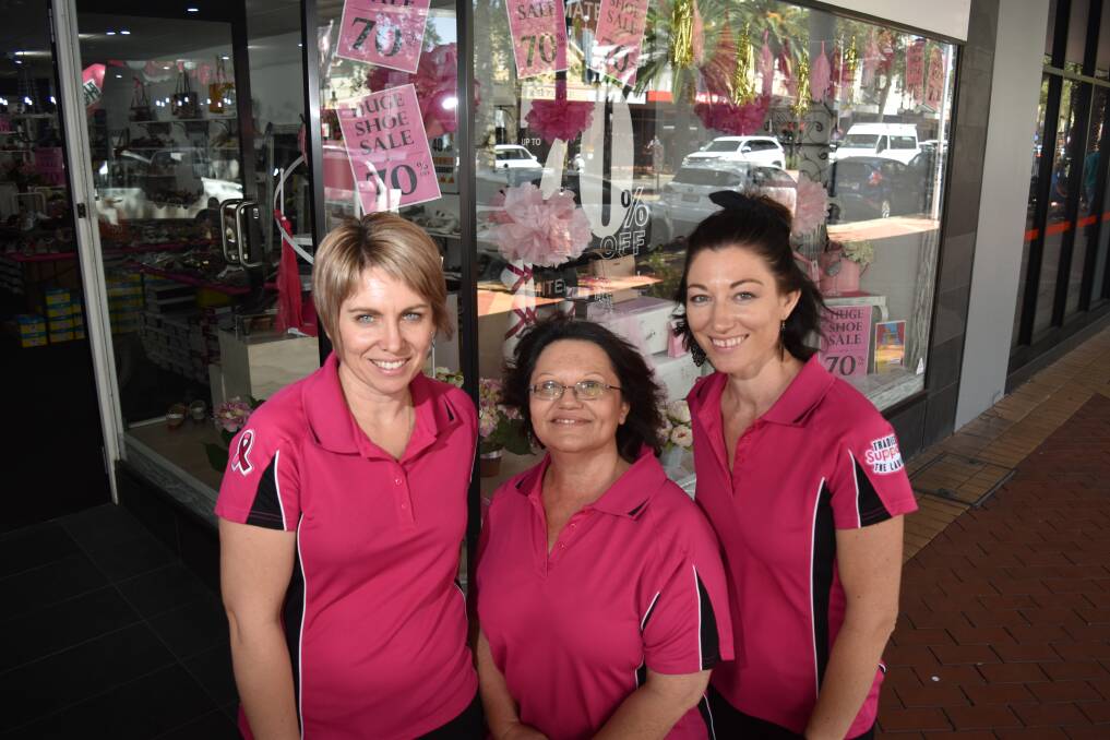 PRETTY IN PINK: Kristie Train, Jenine Schembri and Beck Fittler from Easy Living Footware showed their support by decking the store in pink. Photo: Ben Jaffery