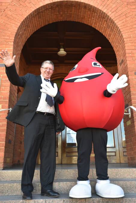 NATION'S BEST: Mayor Col Murray and Billy the Blood Drop celebrating council's achievement at Town Hall. Photo: Jamieson Murphy 250716JM04