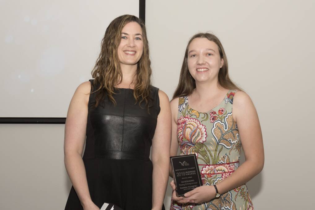 YOUNG BUSINESS WIZARD: NSW Business Chamber's Sarah Peacock presents Rianna Feenstra with her award. Photo: Peter Hardin