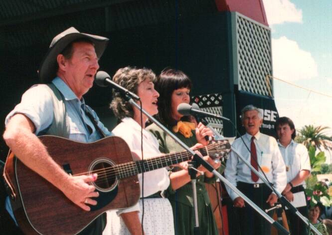 VALE: Bob Hawke (right) watches Slim Dusty perform at the country music festival. Photo: June Underwood