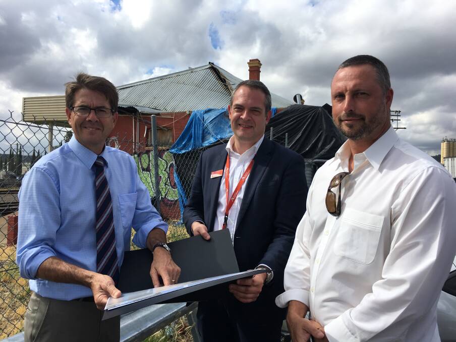 WAY FORWARD: Kevin Anderson, NSW TrainLink’s Pete Alloway and Dan Champness inspect West Tamworth Railway Station.