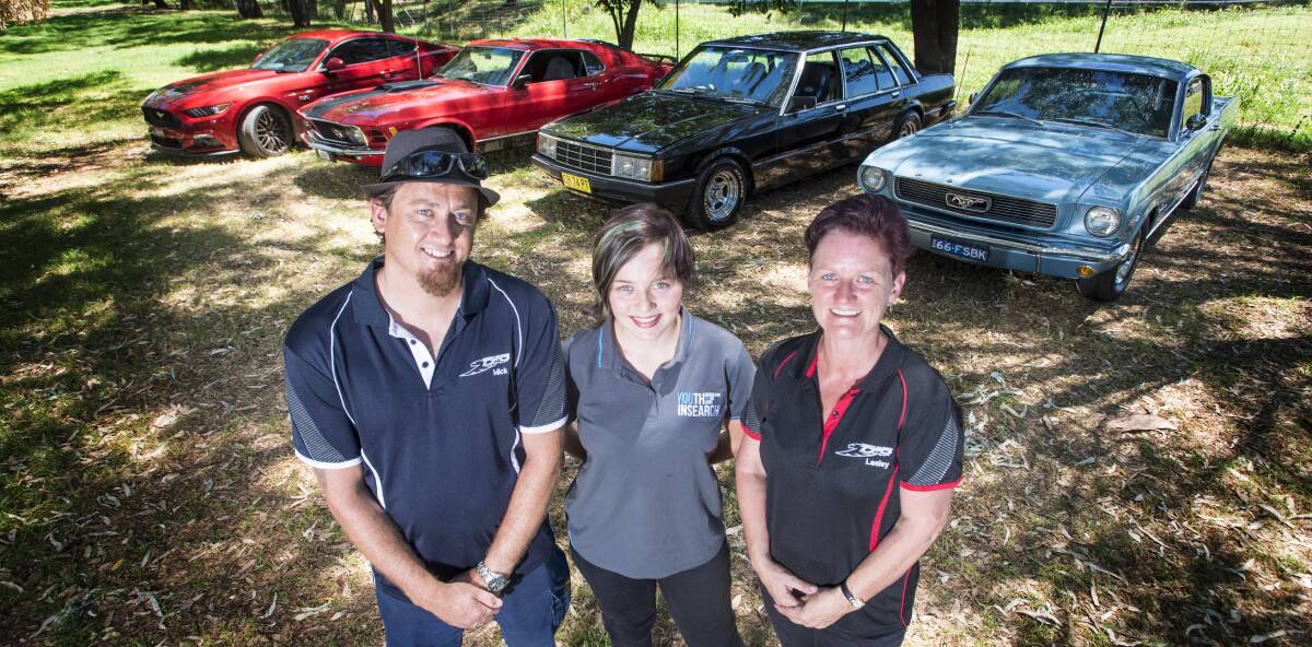 CARS FOR A CAUSE: Mick Mehrton, Aimee Caulfield and Lesley Douglas in front of some serious horsepower. Photo: Peter Hardin 060217PHB007