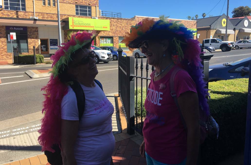 COLOURFUL BIRDS: Eileen Edwards and Samantha Van Zonneveld of Hervey Bay get into town early on Saturday morning to beat the heat. Photo: GENEVIEVE SMITH. 