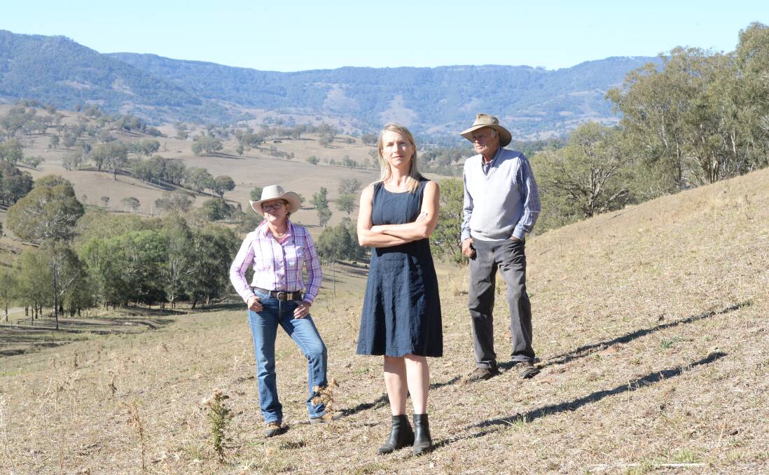Vicki Dempsey, "Koobah", Nundle, Hills of Gold Preservation Inc member Megan Trousdale, Nundle, and Ian Worley Snr, "Yellow Rock", Nundle stand at the headwaters of three river systems. None want a wind farm on the hills.