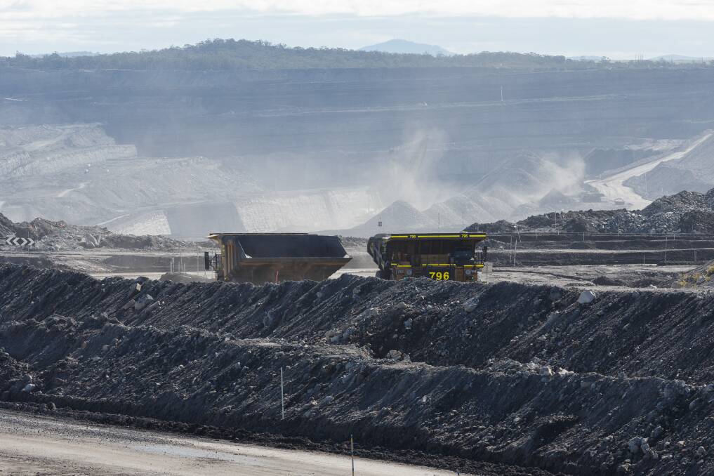 MINING REALITY: View of Yancoal's Mount Thorley/Warkworth open-cut last week. The NSW government says large parts of the state's coal reserves will not be available for 'proactive' exploration but leases adjacent to existing mining areas are exempt from this promise. Picture: Max Mason-Hubers
