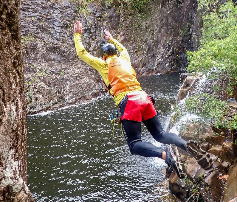 After some encouragement, Michael Turtle jumps into Behana Canyon. Picture: Dominic Godwin
