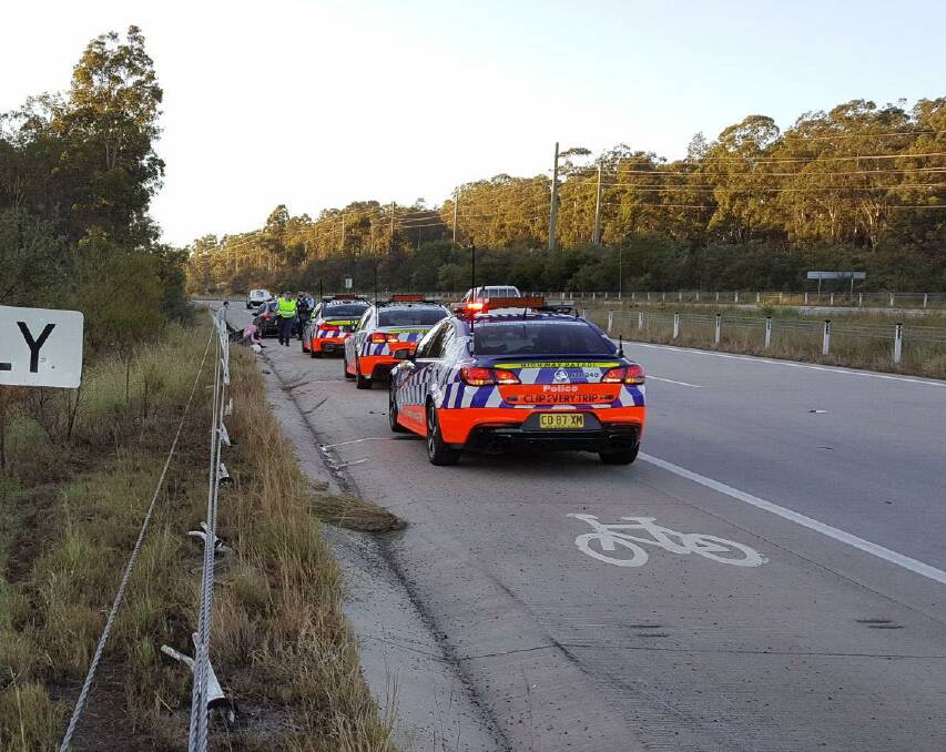 Arrested: Polcie at the scene of the crash on the Hunter Expressway where the Tamworth man was arrested. Photo: NSW Police