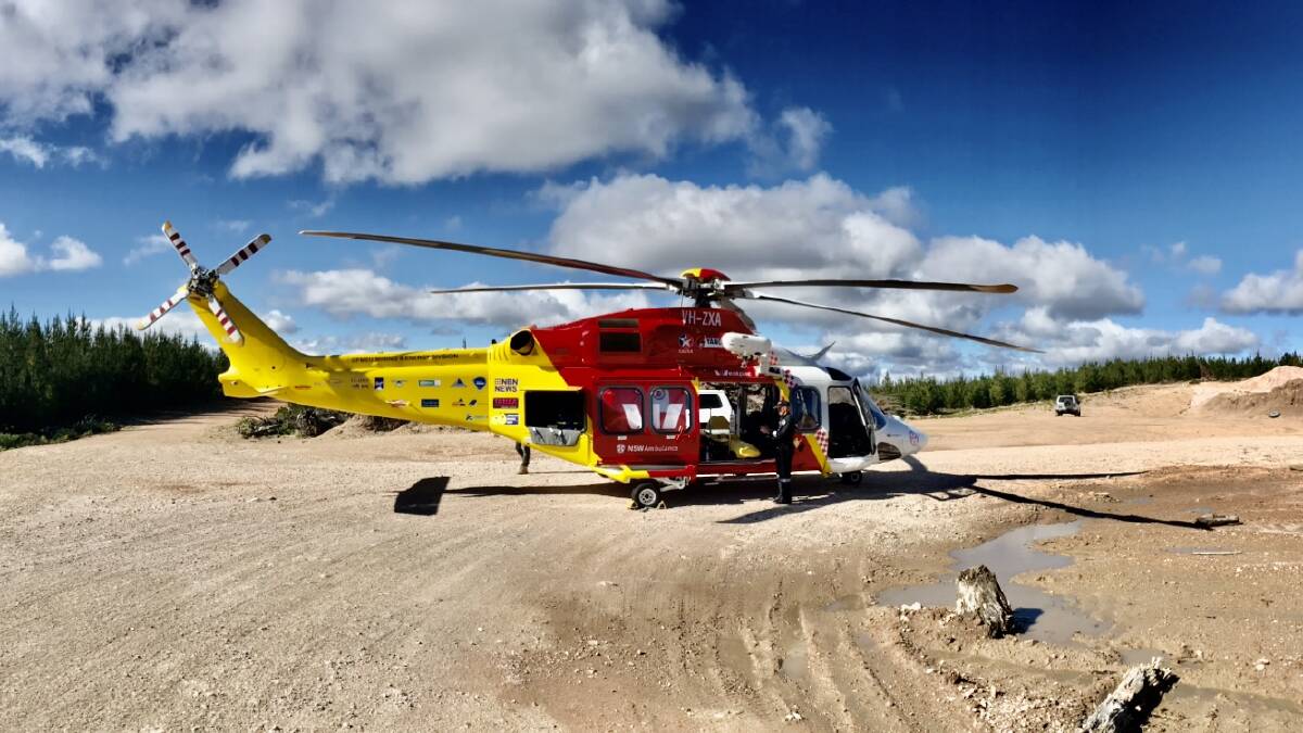 Emergency mission: The Westpac Rescue Helicopter on scene in the Nundle State Forest on Sunday. Photo: Westpac Rescue Helicopter