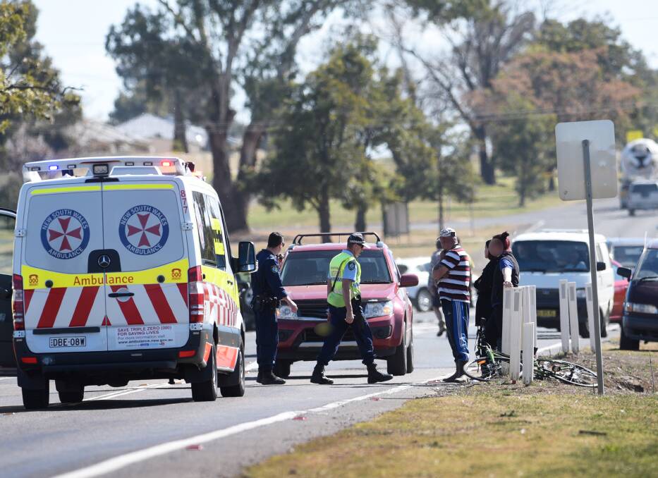 Crash scene: Emergency services and witnesses at the site on the Oxley Highway at Westdale on Tuesday. Photo: Gareth Gardner