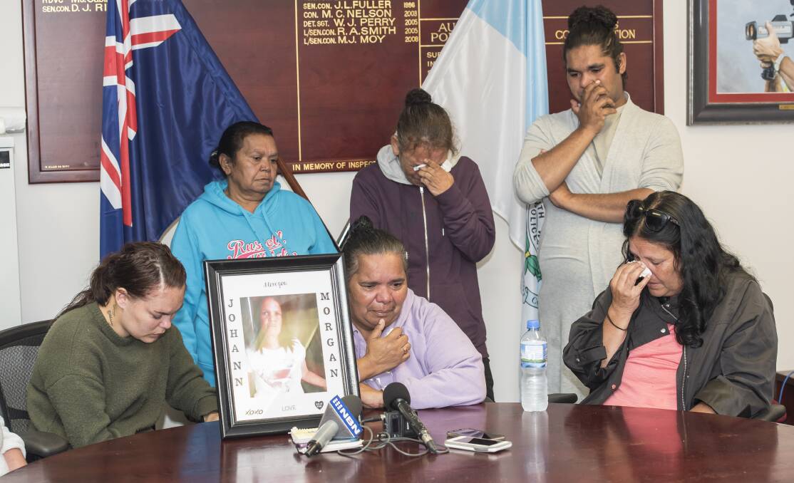 Search for answers: Johann Morgan's family, including daughter Tamika, Yvonne, Vivienne, Stephanie, Zach and Rhonda Morgan. Photo: Peter Hardin