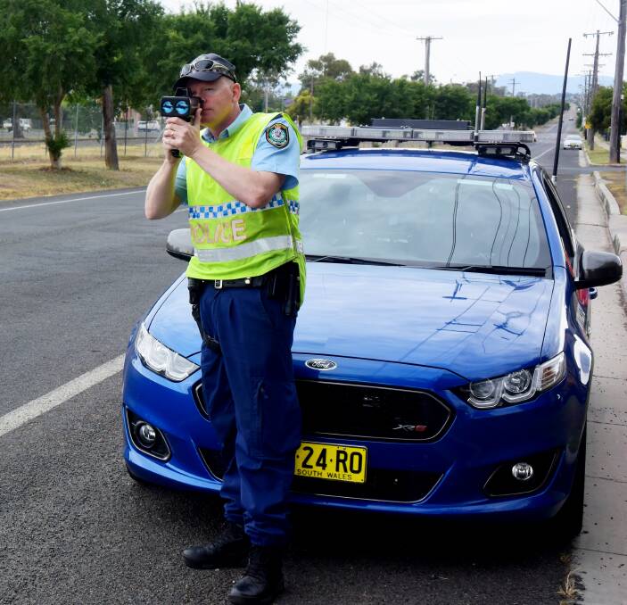 Police blitz: Highway Patrol Senior Constable Richard Hooley conducts speed checks in West Tamworth on Thursday as part of Operation Safe Speed.