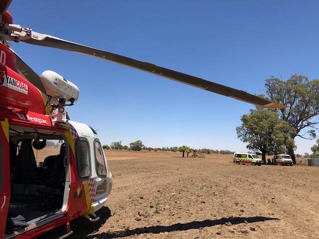 Mission: The Westpac Rescue Helicopter and paramedics on scene in Tooraweenah on Monday. Photo: Westpac Rescue Helicopter