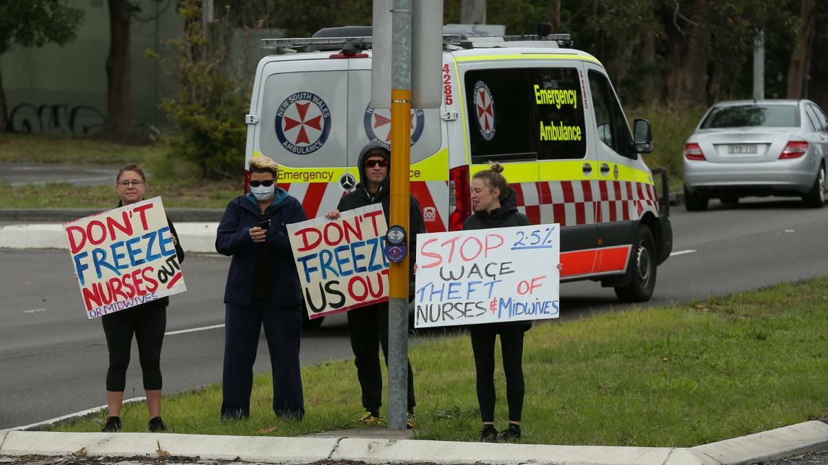 Wage freeze: Nurses peacefully protest on the corner of Lookout Road and Kookaburra Circuit Near John Hunter Hospital on Tuesday to oppose a wage freeze. Picture: Simone De Peak