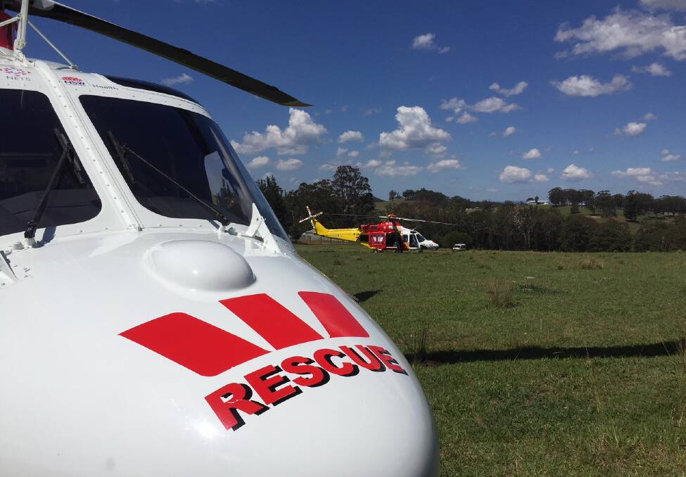 Emergency mission: The Westpac Rescue Helicopters from Tamworth and Lismore at the scene of the crash on Thursday afternoon. Photo: Westpac Rescue Helicopter Service