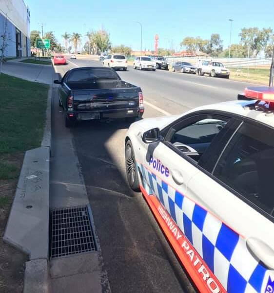 Blitz: The black ute was stopped by highway officers in Peel Street, Tamworth, about midday on Thursday. Photo: NSW Police